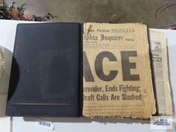 Presidential newspaper articles, tribute to John F. Kennedy book, victory in the gulf photo journal.