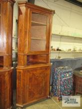 Antique mixed wood corner cabinet made by Carl Stocheck & Co.