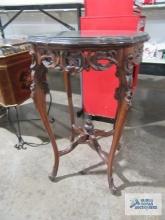 Mahogany carved accent table with glass top
