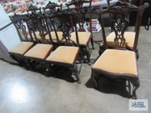 Eight hand carved antique mahogany dining room chairs. Two have a minimal difference in pattern