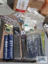Assorted knitting needles and knitting items