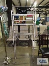 Metal three tier bathroom shelf.