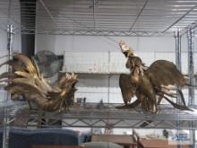 Two heavy metal rooster figurines