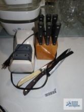 Knife block with steak knives, knife sharpener, and other knives