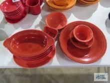 Assorted Fiesta dishware, orange. condiment holder has cracks.