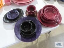 Assorted Fiesta dishware, cranberry, purple, and black