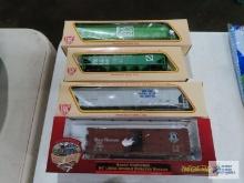 Three IHC ho gauge box cars new in boxes. one Ertl collectibles box car new in box.