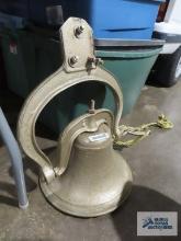 Gold painted bell includes clapper. 14 in wide. Bell body is 9-1/2 in tall. overall height is 24 in