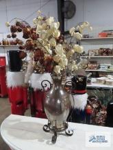 Metal with iridescent glass vase and floral arrangement