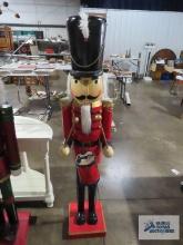 Wooden nutcracker with drum, approximately 5 ft tall