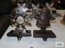 Metal Ohio State stocking holder and cast iron Santa Claus stocking holder.