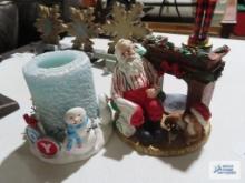 Santa Claus by the fireplace and Snowmen candle holders