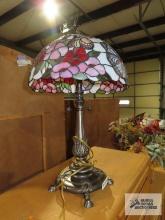 Metal floral based lamp with plastic tiffany style shade