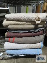 Eight assorted furniture moving blankets