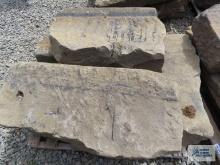 Four heavy sandstone blocks.