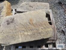 Four heavy sandstone blocks.
