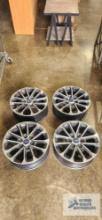 Four 18x7.5 Ford rims with wheel sensors.