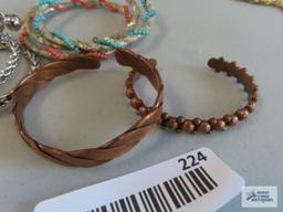 Copper colored cuff bracelets, beaded bracelets, and others