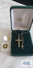 Two cross pendants, small one marked 120 12K gold filled, both chains marked 120 12K GF, and 27-year