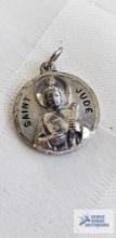 Saint Jude silver colored pendant marked Creed Sterling