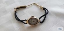 Ladies Bulova watch marked 10K gold filled monogrammed MDB number I353787 on rope like band marked