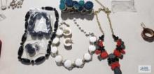 Costume jewelry necklaces and earrings