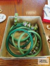 Green floral stone necklace and green plastic bangle bracelets