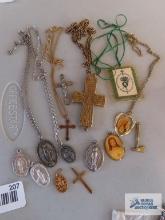 Variety of costume jewelry religious items