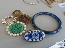 Variety of pins and floral bracelet