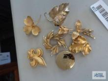 Gold colored pins and scarf clip