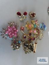 Variety of colorful gemstone pins. Some made in Austria, Avon, Givenchy