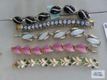Variety of stone bracelets. One is Coro.