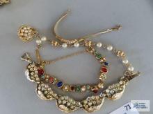 Variety of gold color bracelets, including Goldette Richelieu