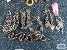 Silver colored bracelets