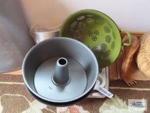Assorted baking pans and colander