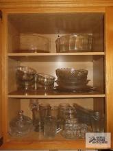 Cabinet of glassware including mugs and bowls