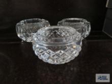 Three ashtrays that can be used as paperweights. one is Powerscourt Waterford Crystal and the other