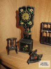 Miniature clock, cast cast iron iron, and plastic rocking chair