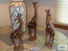 Three hand-carved giraffe figurines, made in Kenya
