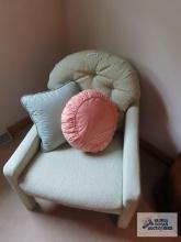pair of green armchairs with pillows on second floor