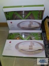 Two 16 piece stainless steel charger sets, new in boxes