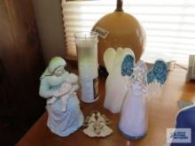 Angel figurines and religious figurine and candle