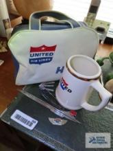 United Airlines pins, mug and handbag