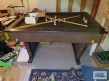 Bumper pool table with accessories in basement. Legs fold up for removal.