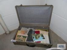 Variety of travel pamphlets in vintage suitcase