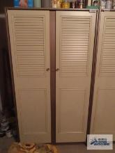 Two-door metal cabinet in basement