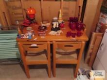 Maple convertible table with four rush bottom chairs in basement