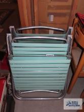 Two folding chaise lounge chairs