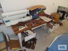 Heavy duty workbench with formica top in garage. 61-1/2 in long by 35-3/4 in wide by 31 in tall