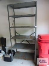 Heavy duty metal adjustable shelving unit in garage